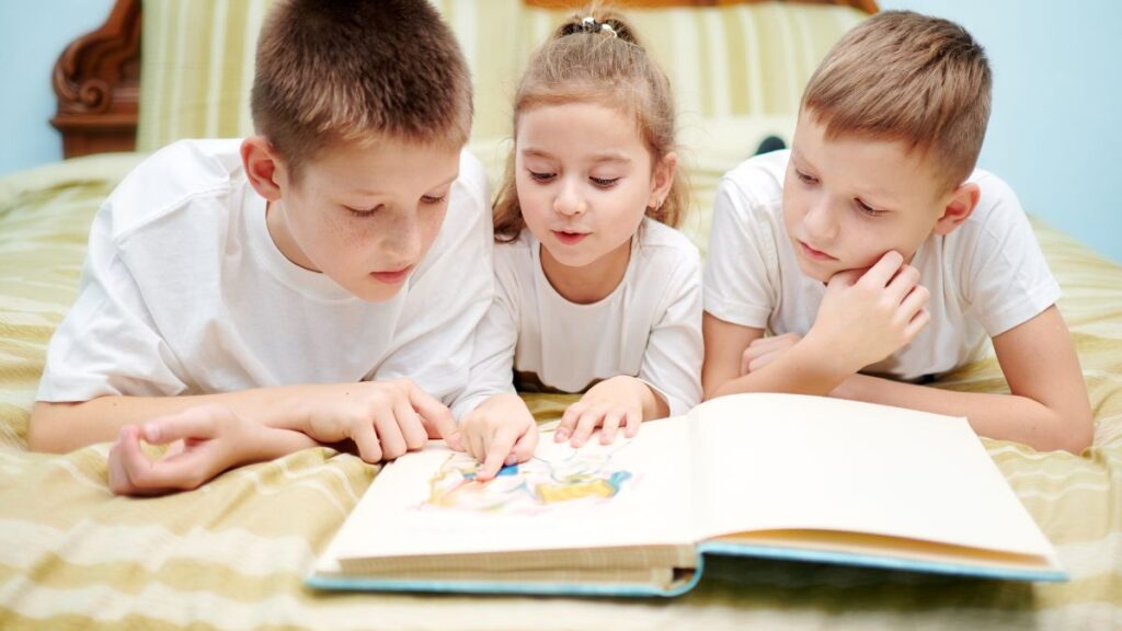 kids opening up a book to read