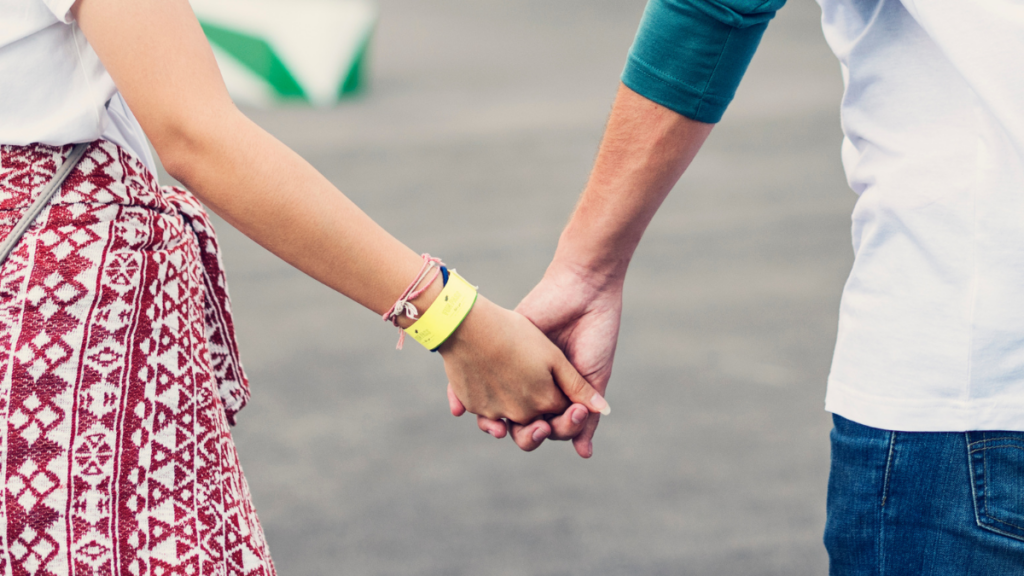 teenagers holding hands