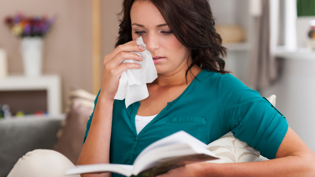 woman crying with book