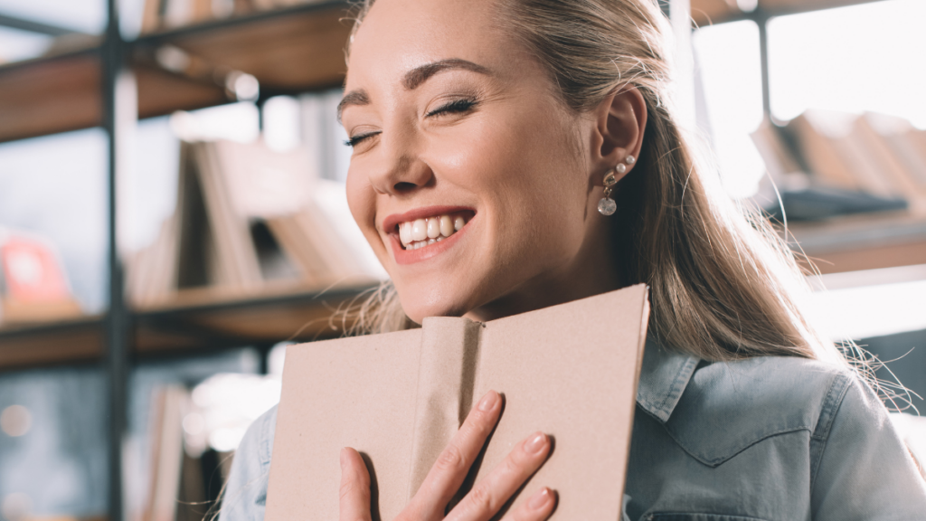 person hugging book