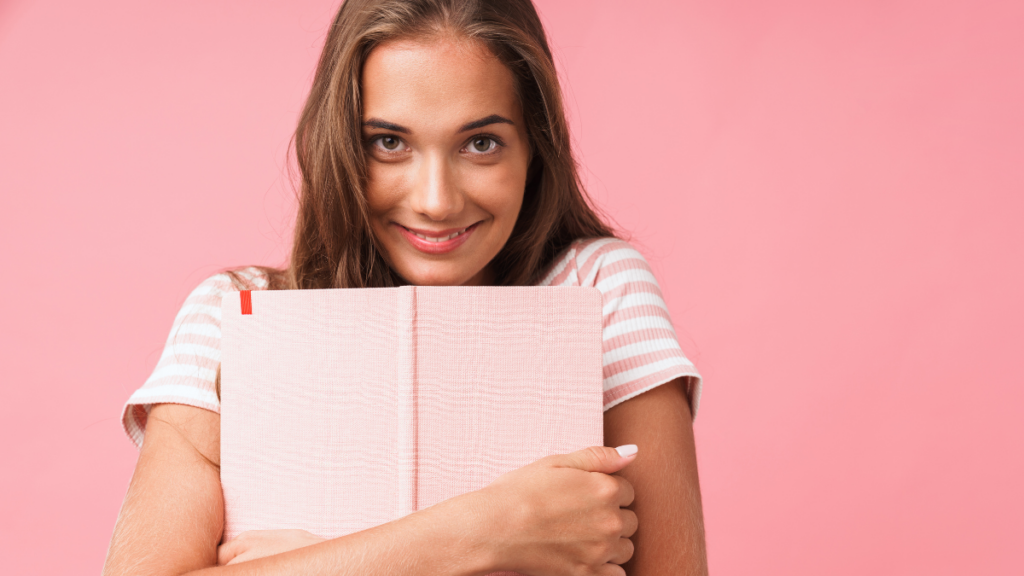 person hugging book